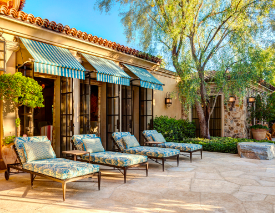 tuscan home patio with awnings