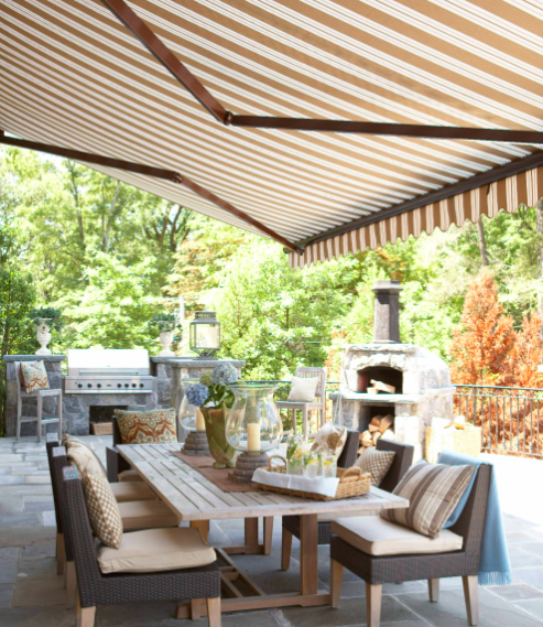 brown and white striped awning traditional patio