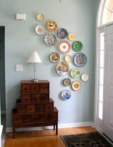 Whimsical plates on wall of entry